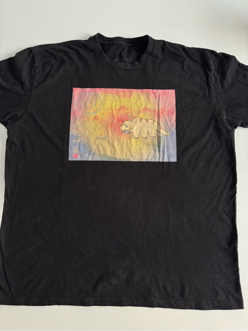 Black Short-Sleeve Graphic Tee with Sunset Animal Motif